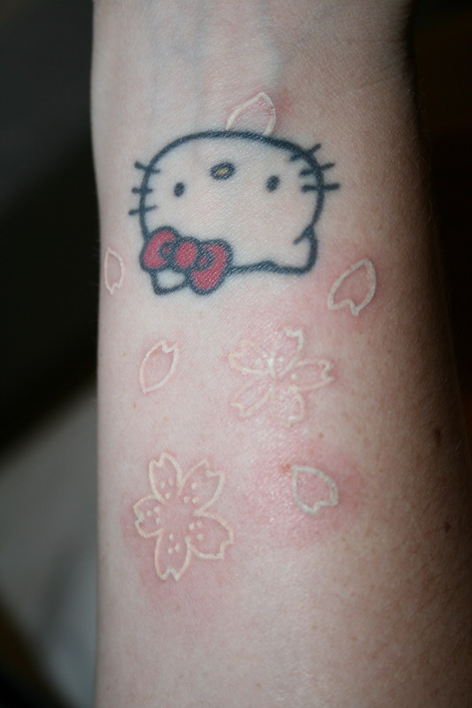 White ink sakura tattoo done in Osaka, Japan