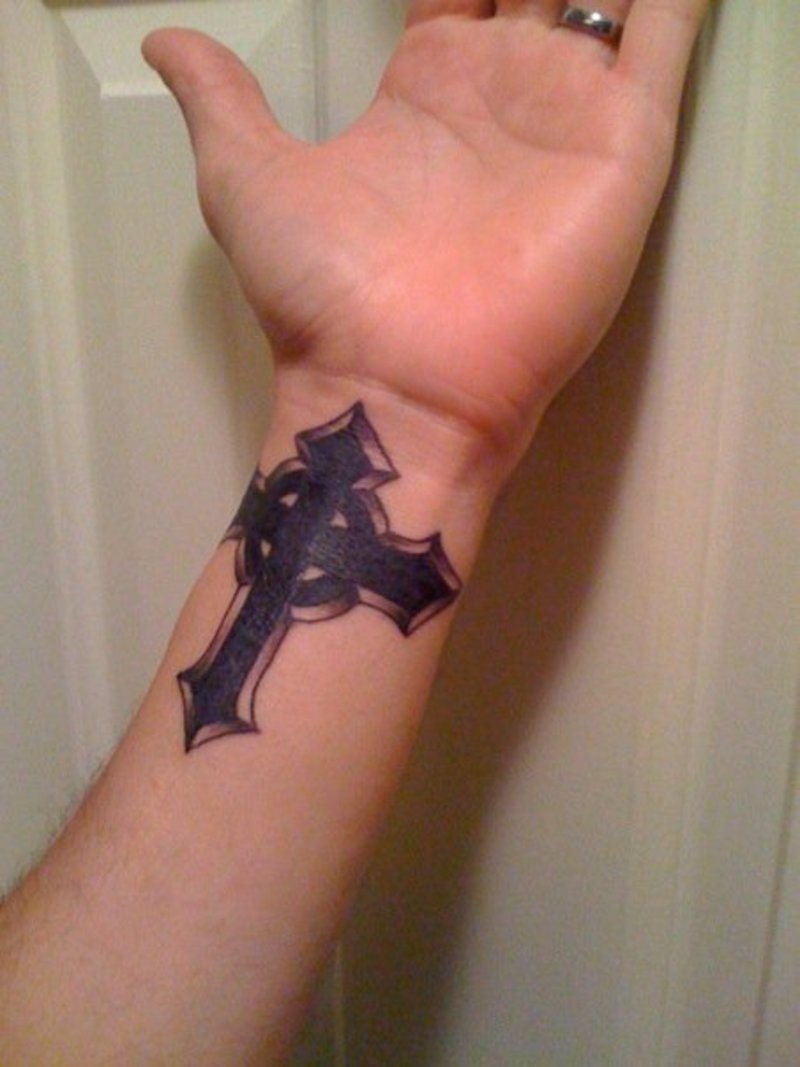 beautiful-black-ink-cross-tattoo-on-left-wrist