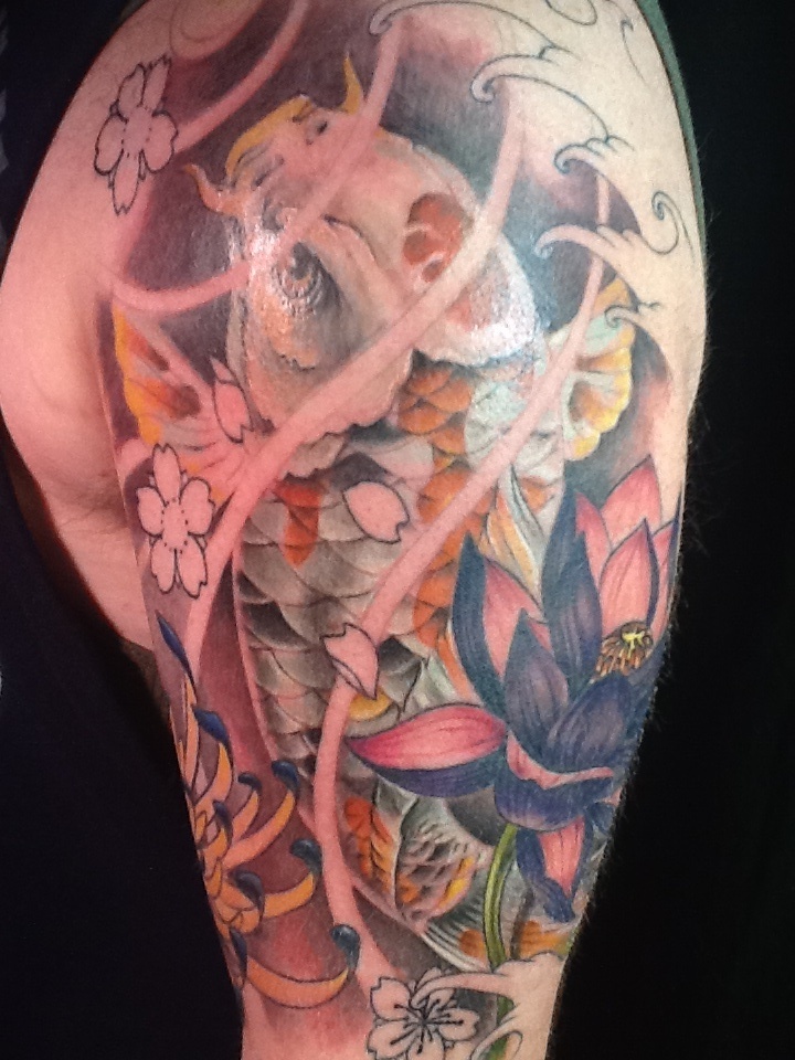 koi-fish-and-lotus-flower-tattoo-designs-on-sleeve