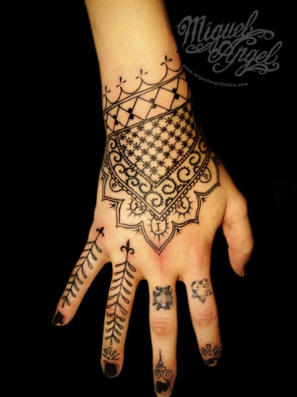 simple henna tattoo on hand