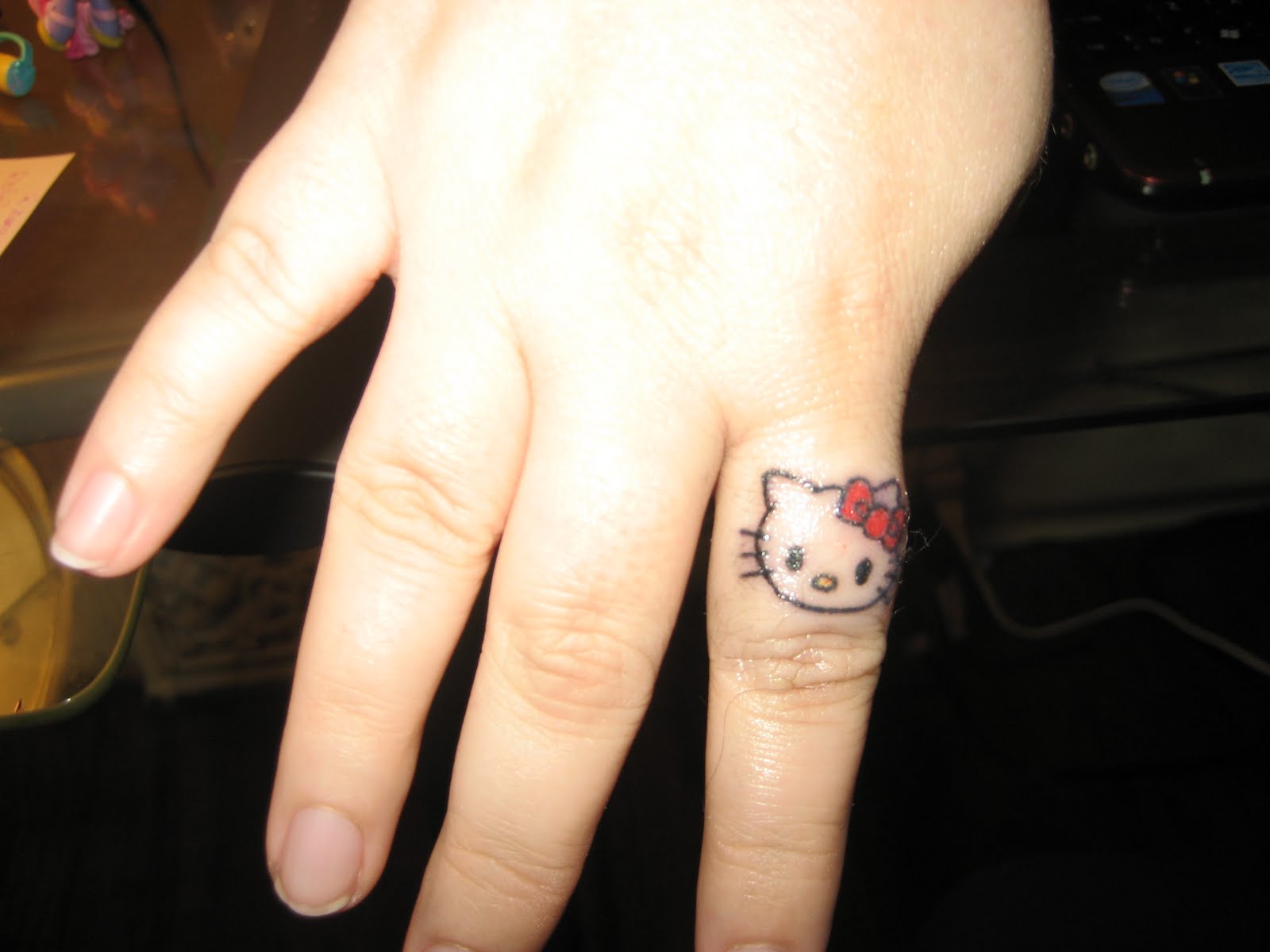 small-hello-kitty-tattoo-on-finger-for-girls