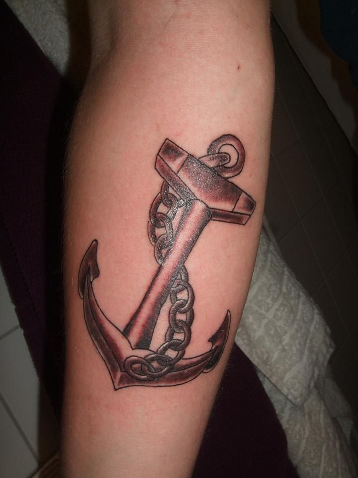 anchor tattoo with chain on arm