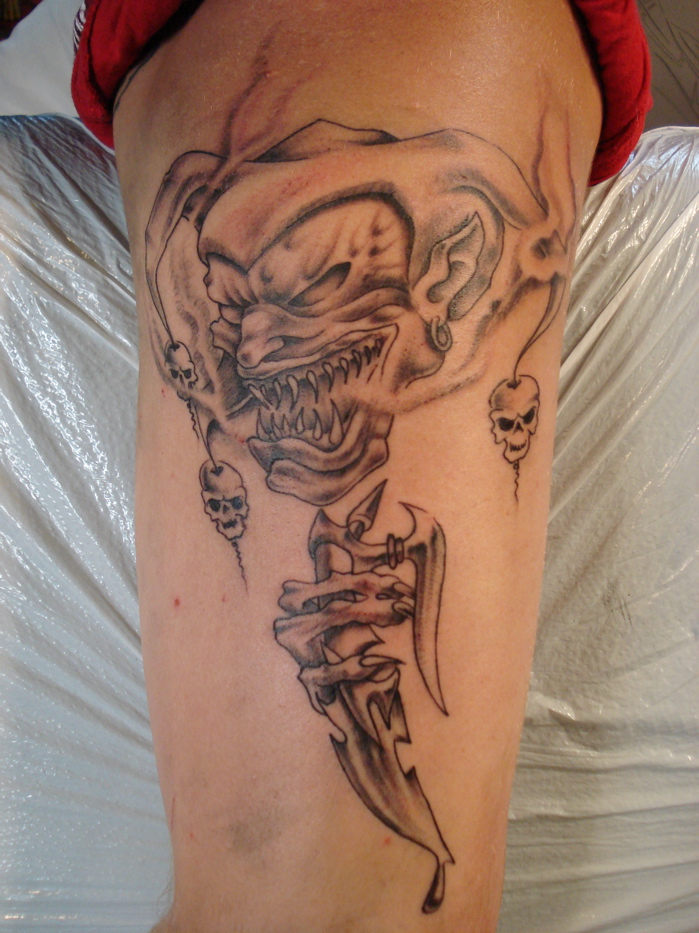 evil-jester-joker-tattoo-on-arm