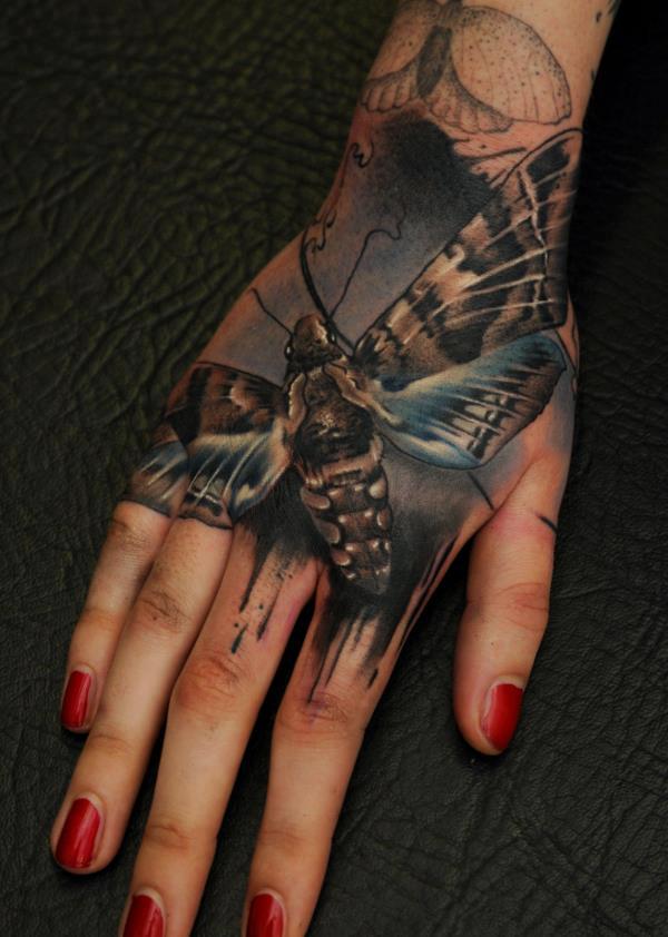 Florian-Karg-Realistic-Hand-Moth-Tattoo