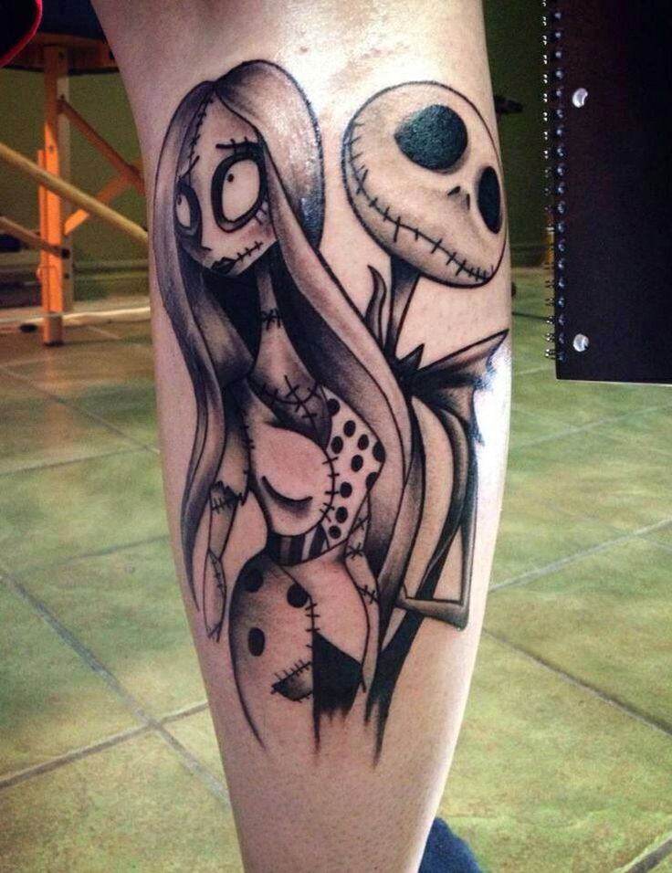 Funny-girl-and-skull-face-tattoo-on-leg