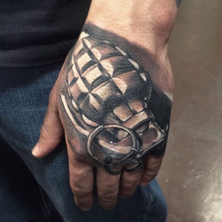 Grenade hand tattoo done by Chris Burnett evangel ink tattoo hesperia