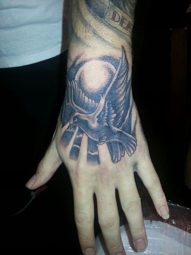 Hand tattoo dove