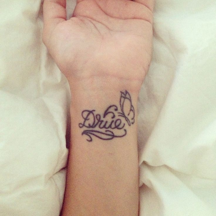 Wrist name tattoo daughter's name