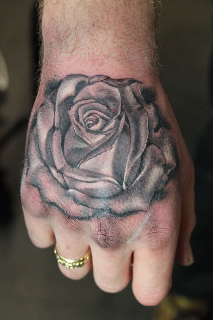 black and grey rose hand tattoo tattoo by Mirek vel Stotker