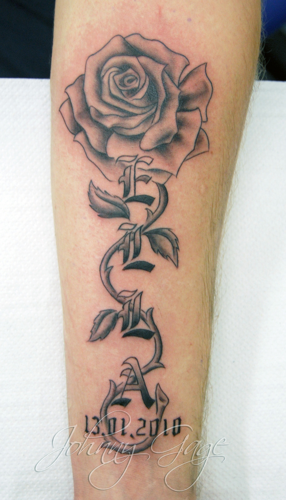name with rose and vine tattoo