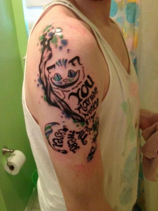 Cheshire Cat tattoo lower right inner arm