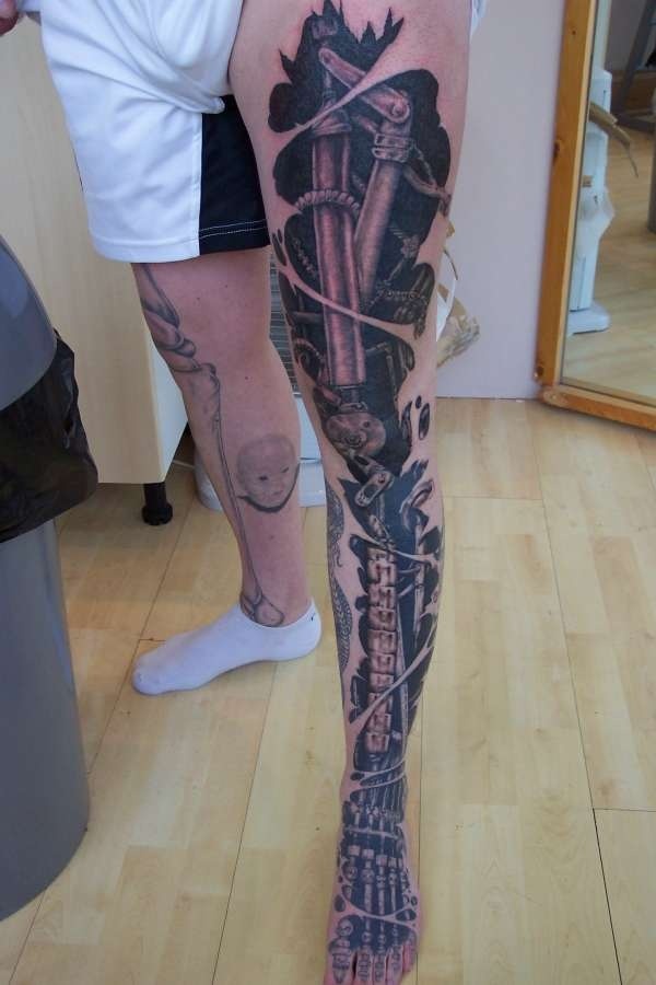 Cool biomechanical leg tattoo