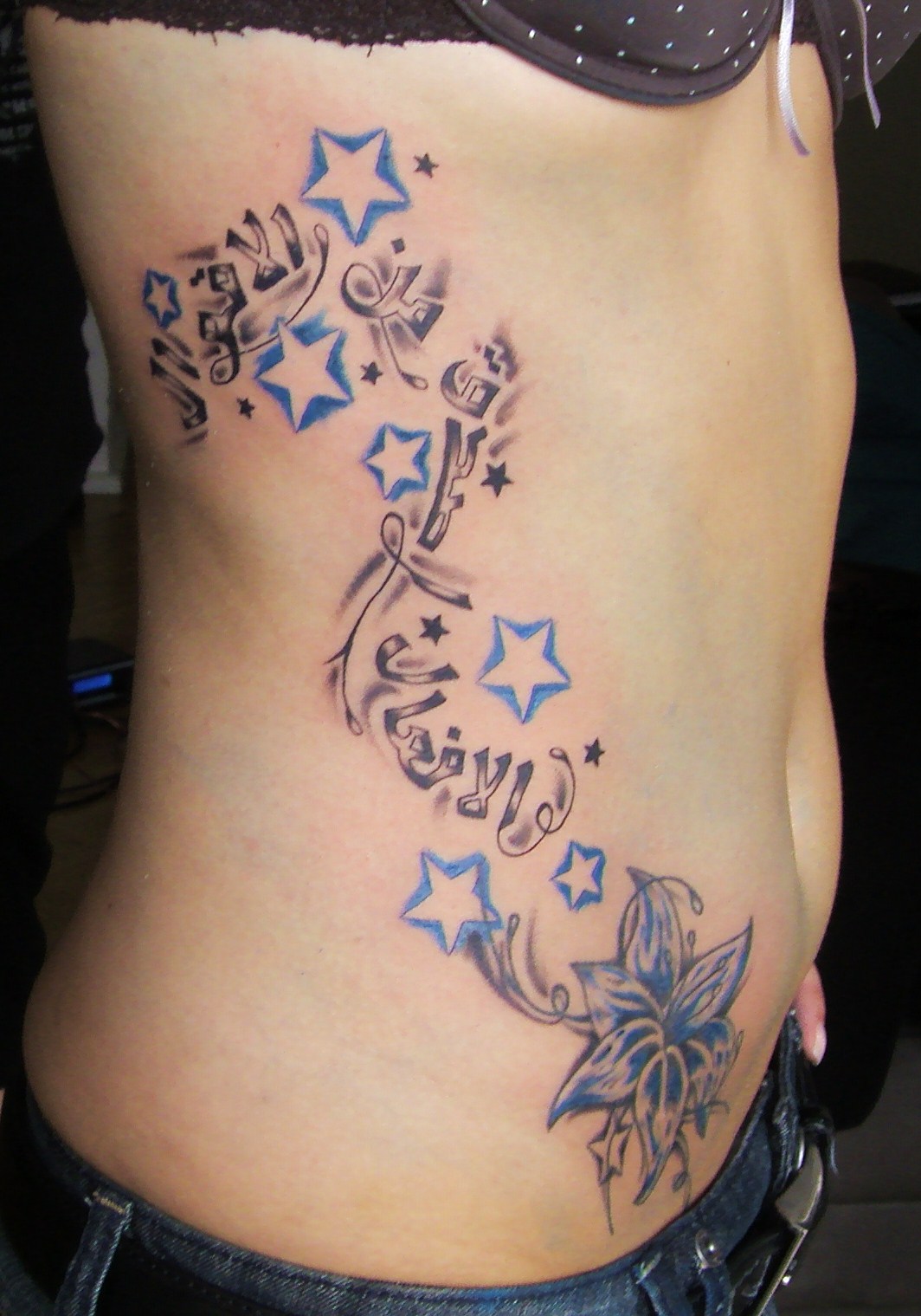 Flower and star tattoo