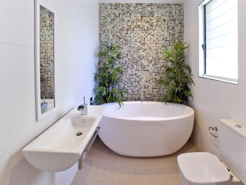 Modern bathroom design with freestanding bath using frosted glass