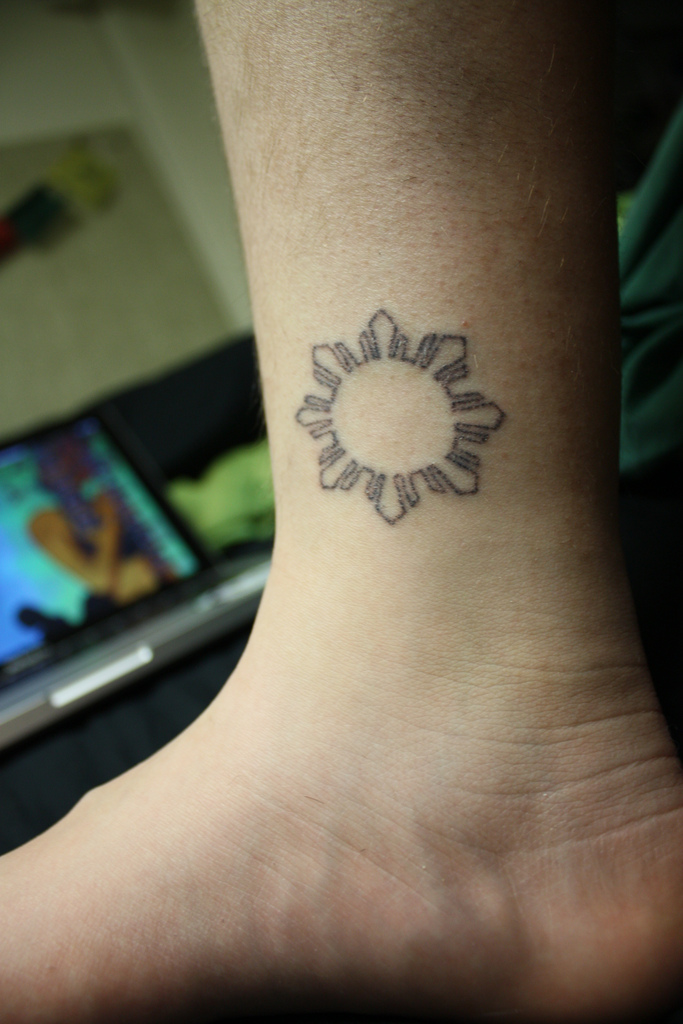 Philippine Sun stick and poke tattoo