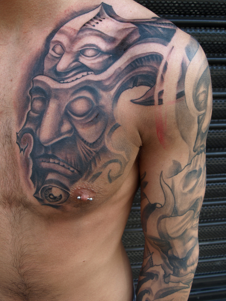 chest mask tattoo