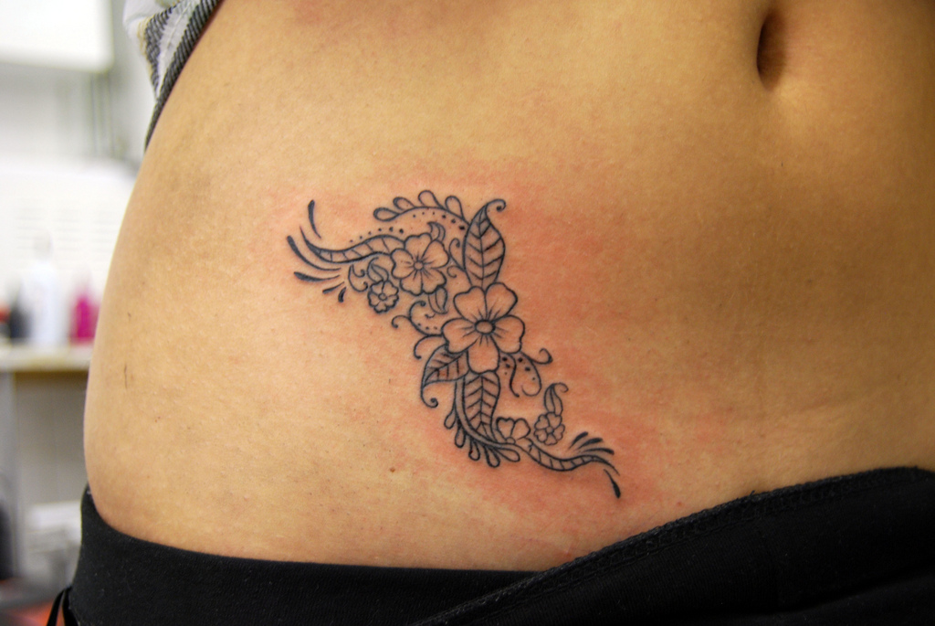 henna style stomach tattoo