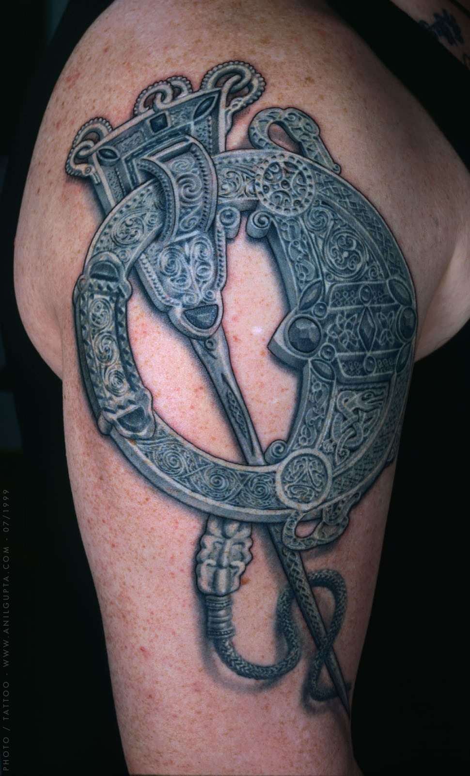 modern celtic tattoo design on shoulder