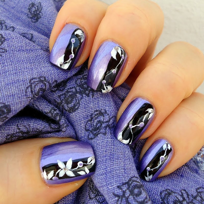 purple black nail art design with flower