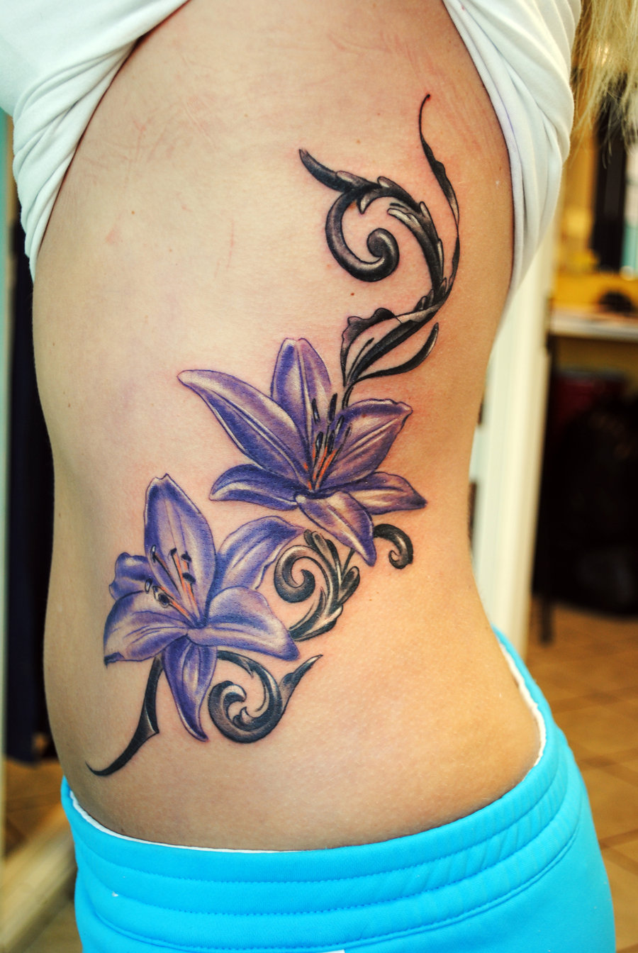 purple-flowers-feminine-tattoo-on-side