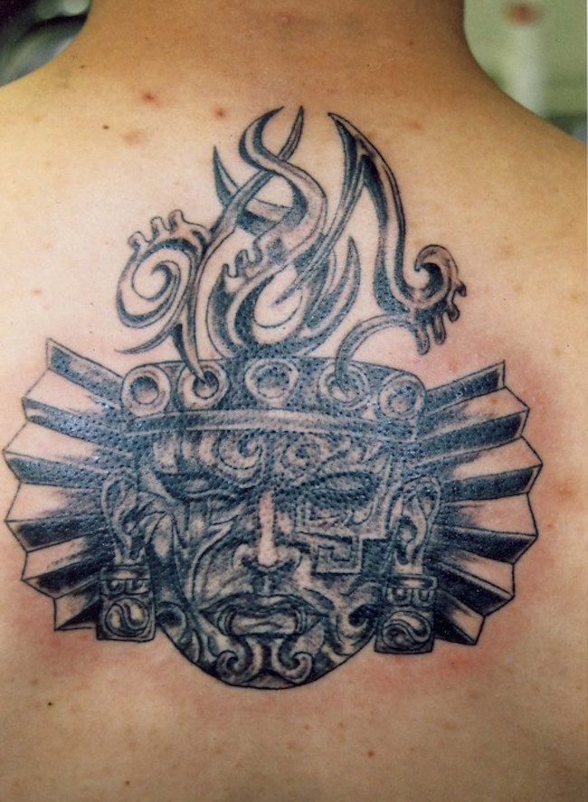 Aztec Face Tattoo On Upper Back