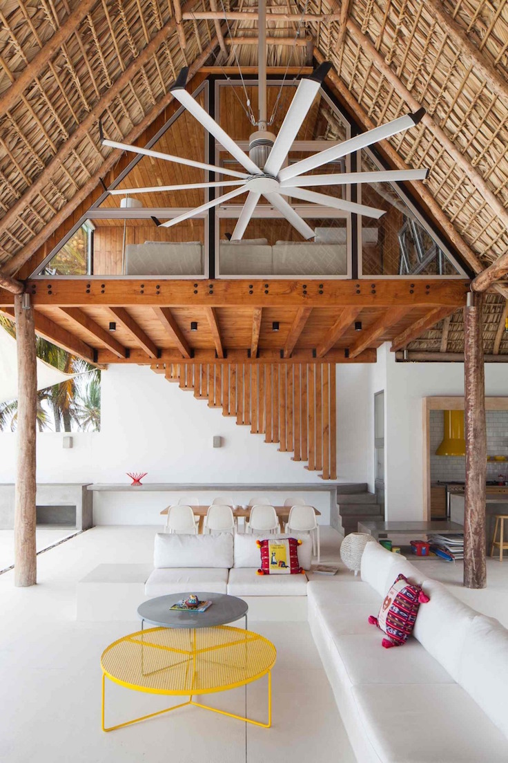 Colorful Tropical Open Home With Rough Cut Thatched Roof 4 tall indoors thumb