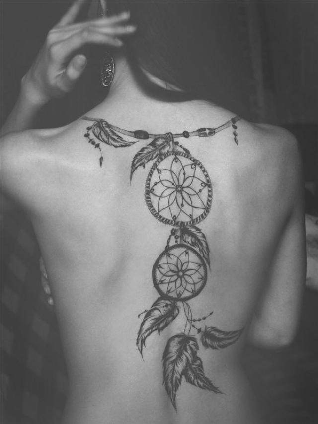 Extravagant heavily tattooed Women spine