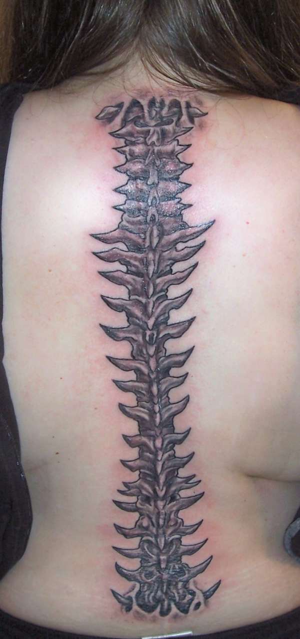 Grey Ink Spine Tattoo On Back