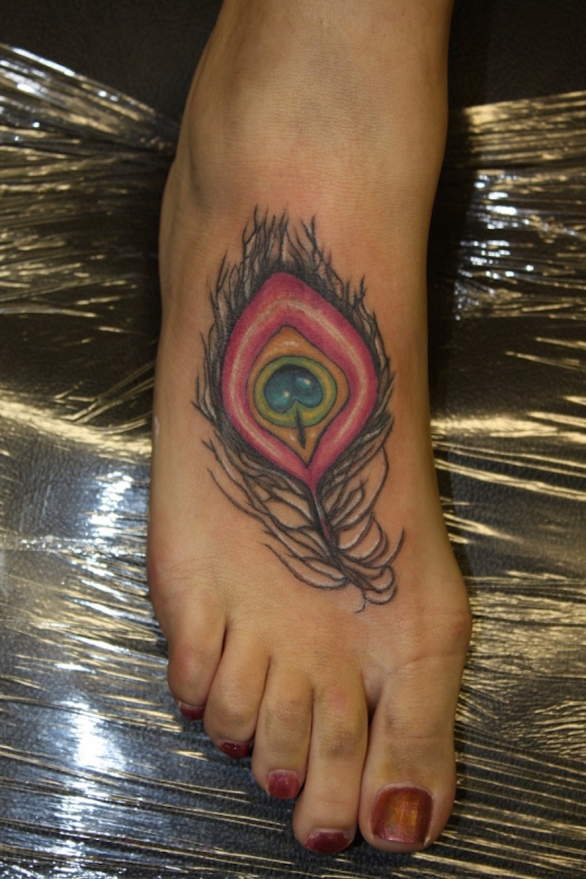Impressive Colored Peacock Feather Tattoo On Girl Right Foot