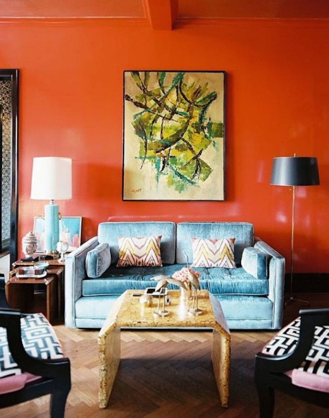 Orange Wall Color With Soft Blue Sofa For Tropical Themed Living Room Ideas