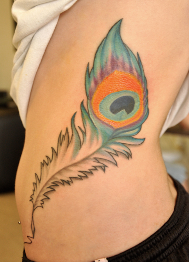Peacock feather on the side of the body