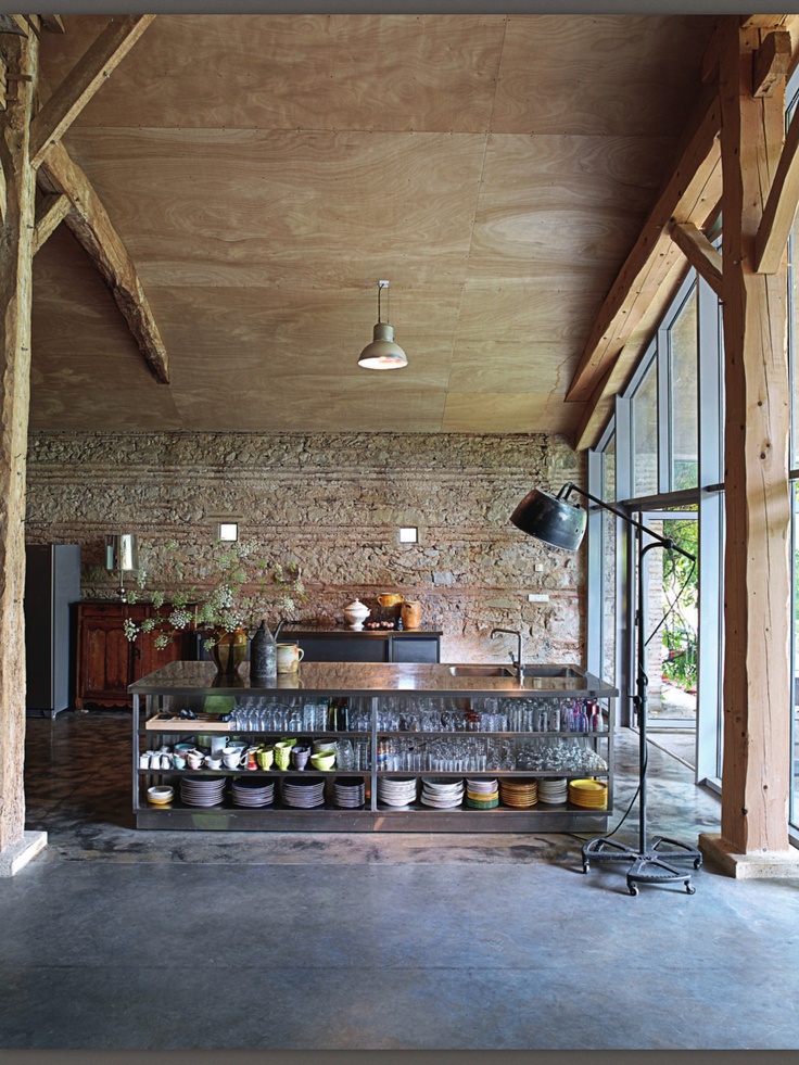 rustic industrial kitchen cement floor exposed beams