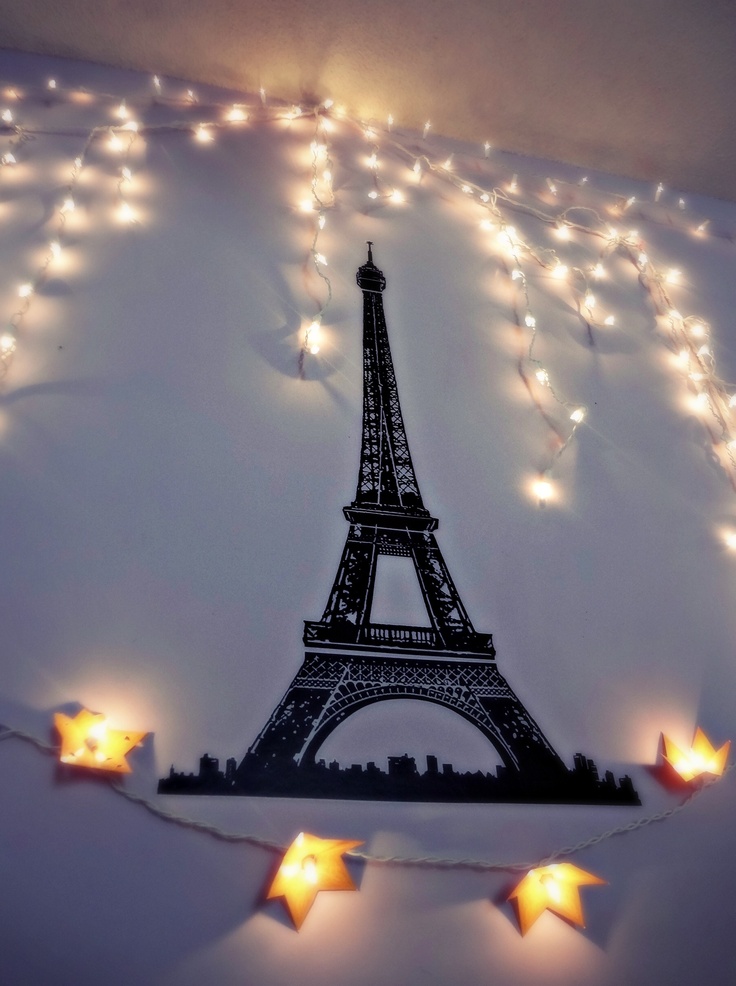 Eiffel tower and christmas lights on bedroom wall