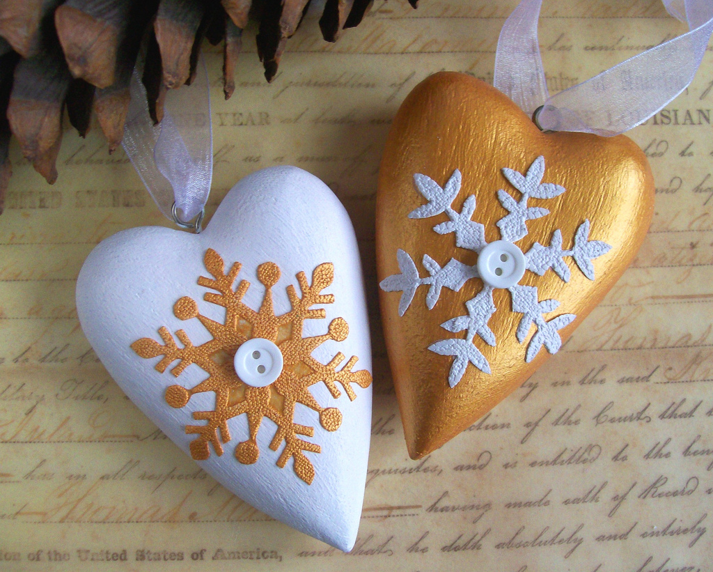 White and gold wooden heart ornaments with white organza ribbon