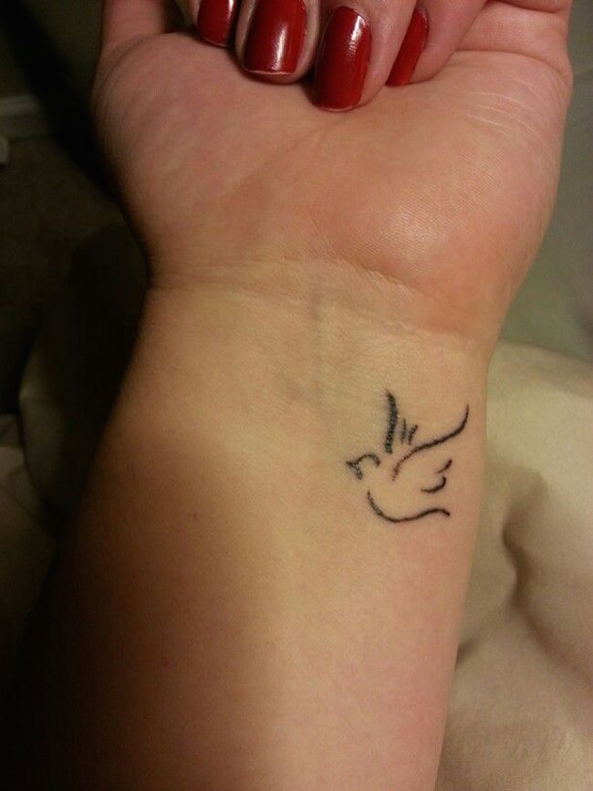 Dove on my left wrist meaning peace and tranquility