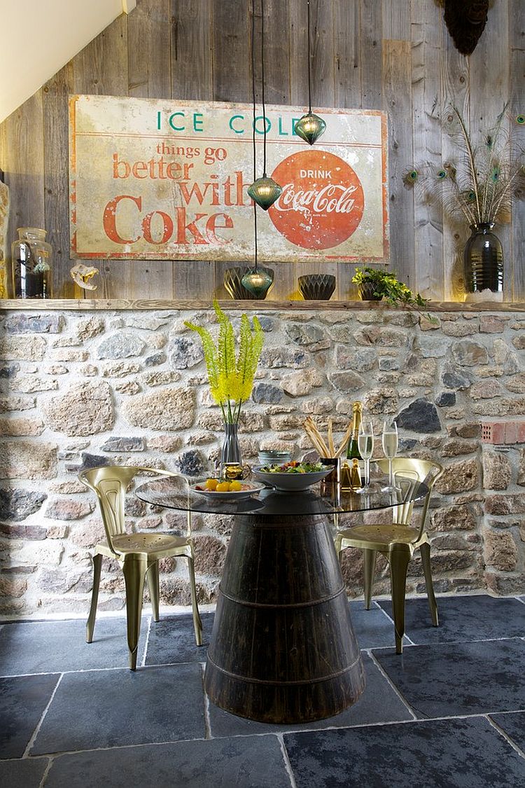 Fabulous eclectic dining room with distressed wood and stone wall