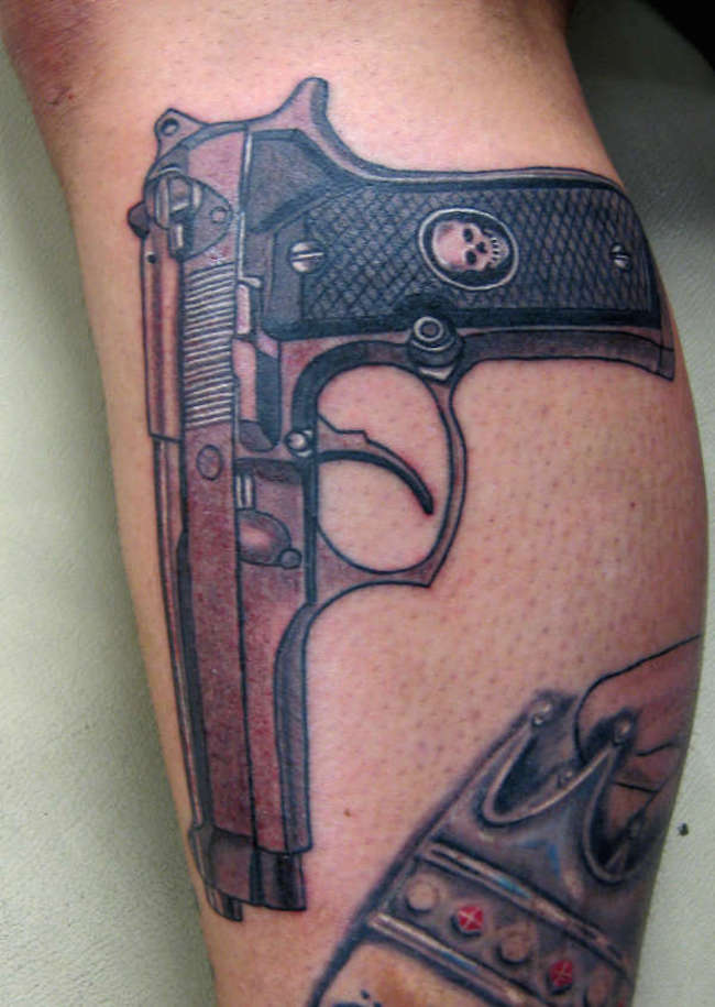 Gud Looking Gun Tattoo Design