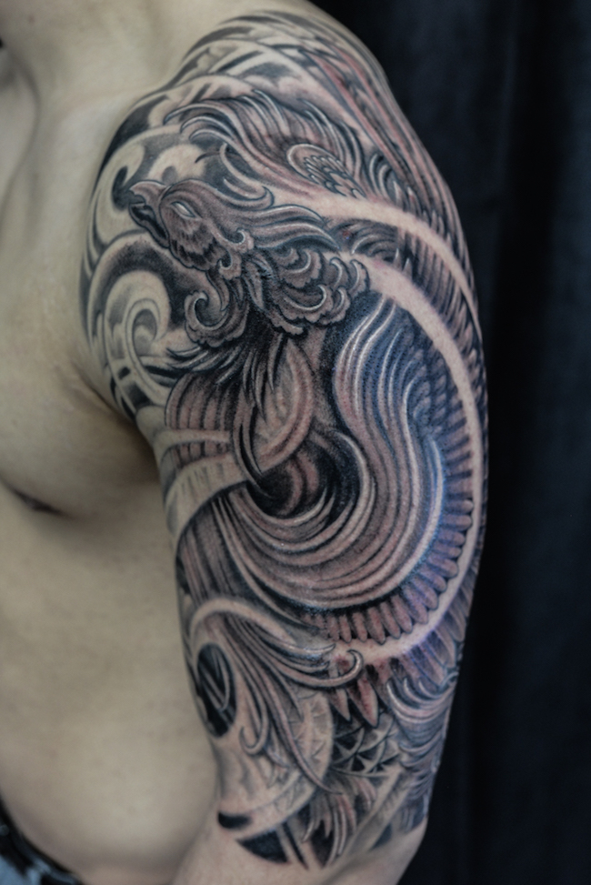 Half sleeve black and grey Phoenix tattoo
