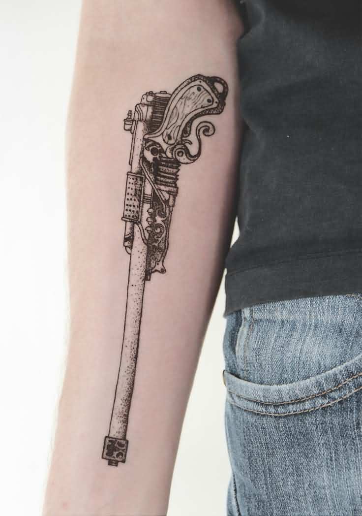 Old Style Gun Tattoo On Arm