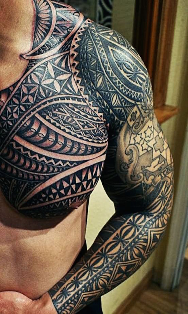 Tattoo On Man Left Sleeve And Chest