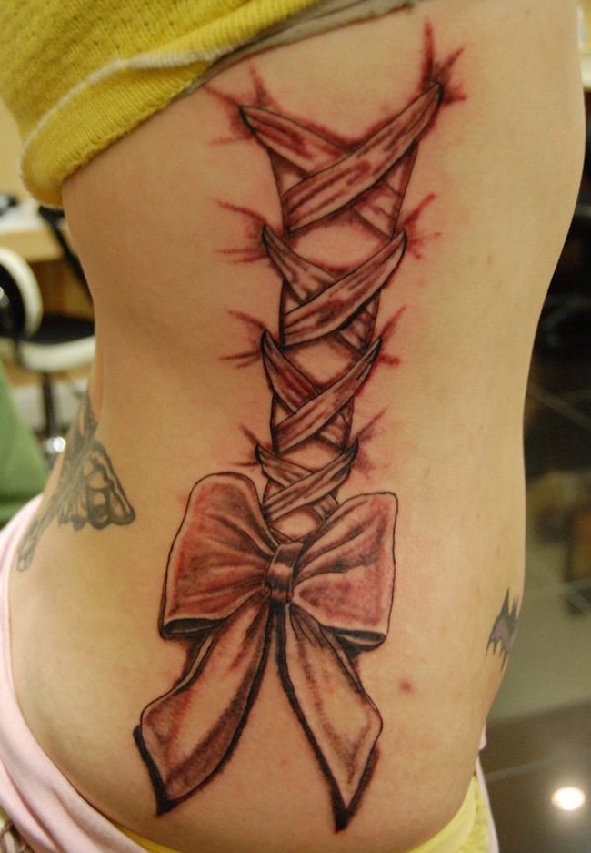 lotus rib tattoo