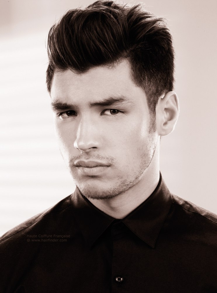 Male hairstyle with a barrel shaped quiff