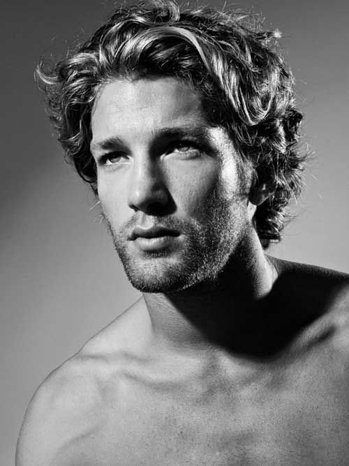 Mid length curly hair style for men