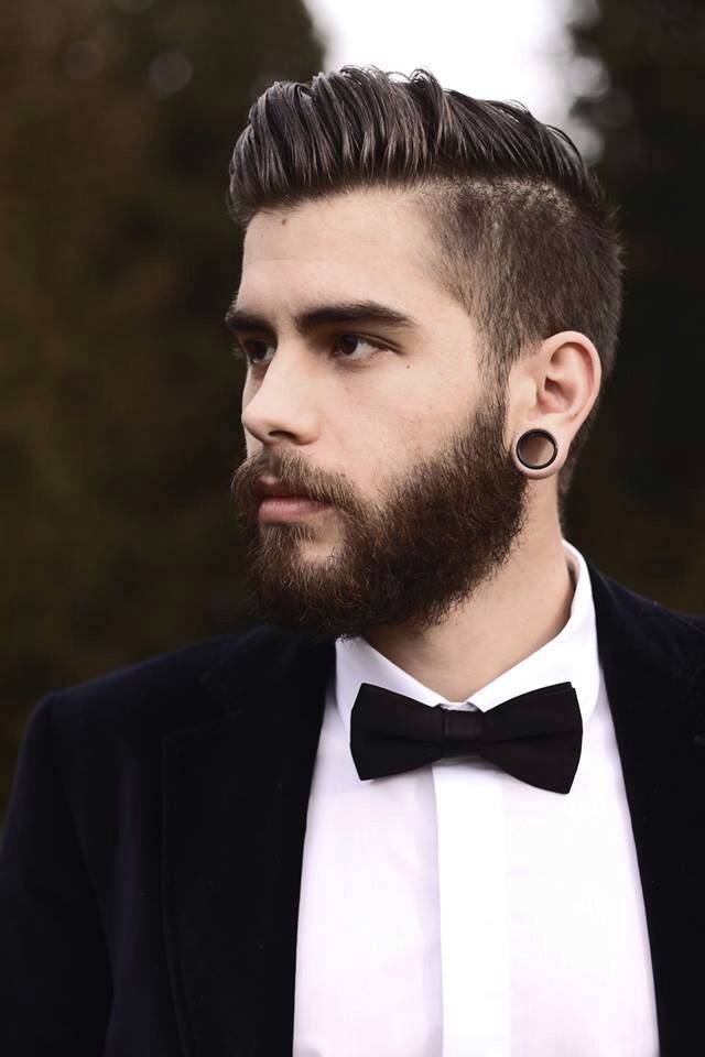 medium side combed hairstyle for men with beard
