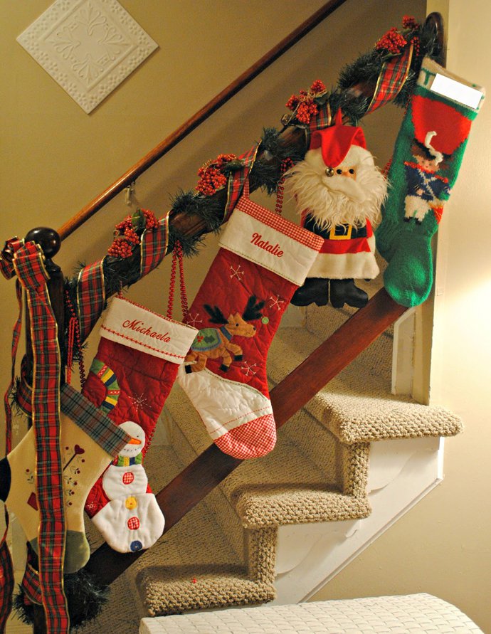christmas stair decoration idea stockings on spindles