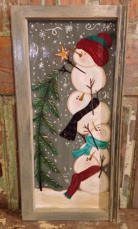 snowmen painted on old window