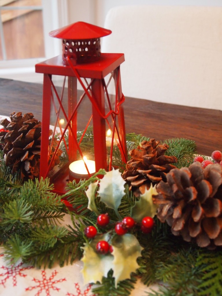 Wooden dining table with christmas centerpiece decorations