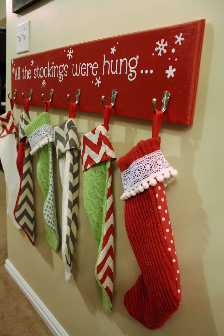 diy christmas stocking hanger on red wood