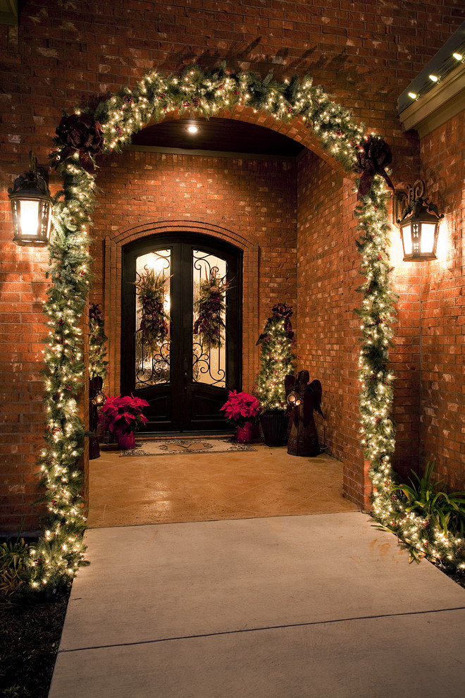 traditional with christmas lights front porch